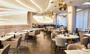 En elegant restaurant med moderne interiør og bord dekket for gjester. (AI-generert tekst)