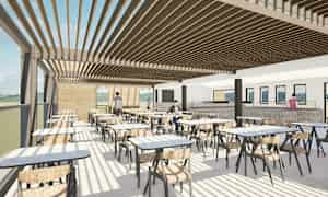 Bildet viser en moderne innendørsrestaurant med store vinduer, bord og stoler samt personer som beveger seg i forskjellige deler av lokalet. (AI-generert tekst)