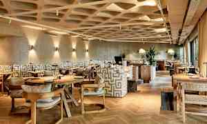 Bilde av en moderne restaurant med stilfull innredning. (AI-generert tekst)