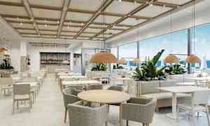 En restaurant med moderne innredning og store vinduer mot havet. (AI-generert tekst)