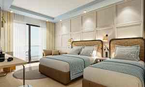 Hotellrom med to enkeltsenger, lys innredning og vindu med gardiner. (AI-generert tekst)