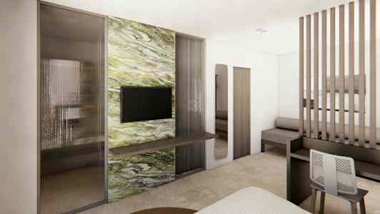 Moderne hotellrom med TV og marmordekor på veggen. (AI-generert tekst)