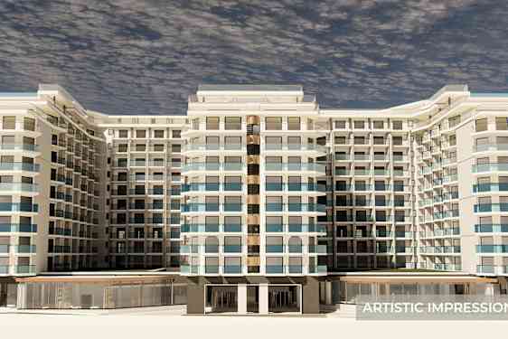 En stor bygning med flere etasjer og mange balkonger sett forfra. (AI-generert tekst)