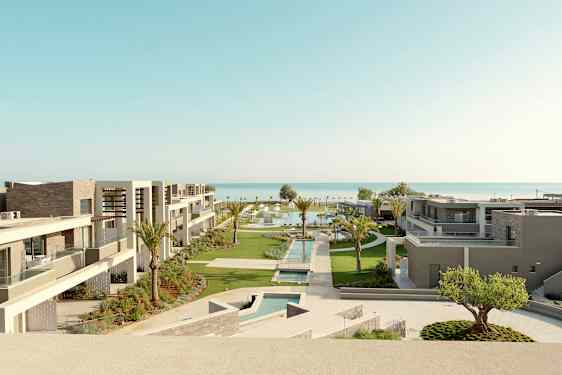 Hotellets moderne bygninger med bassengområder og hager nær sjøen. (AI-generert tekst)