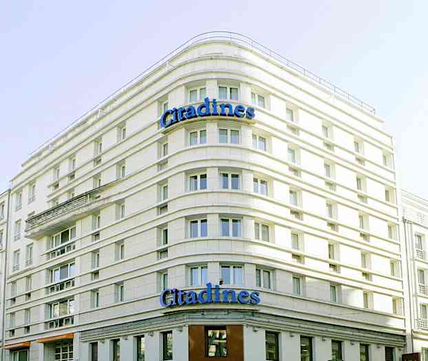En bygning med teksten 'Citadines' på fasaden. (AI-generert tekst)