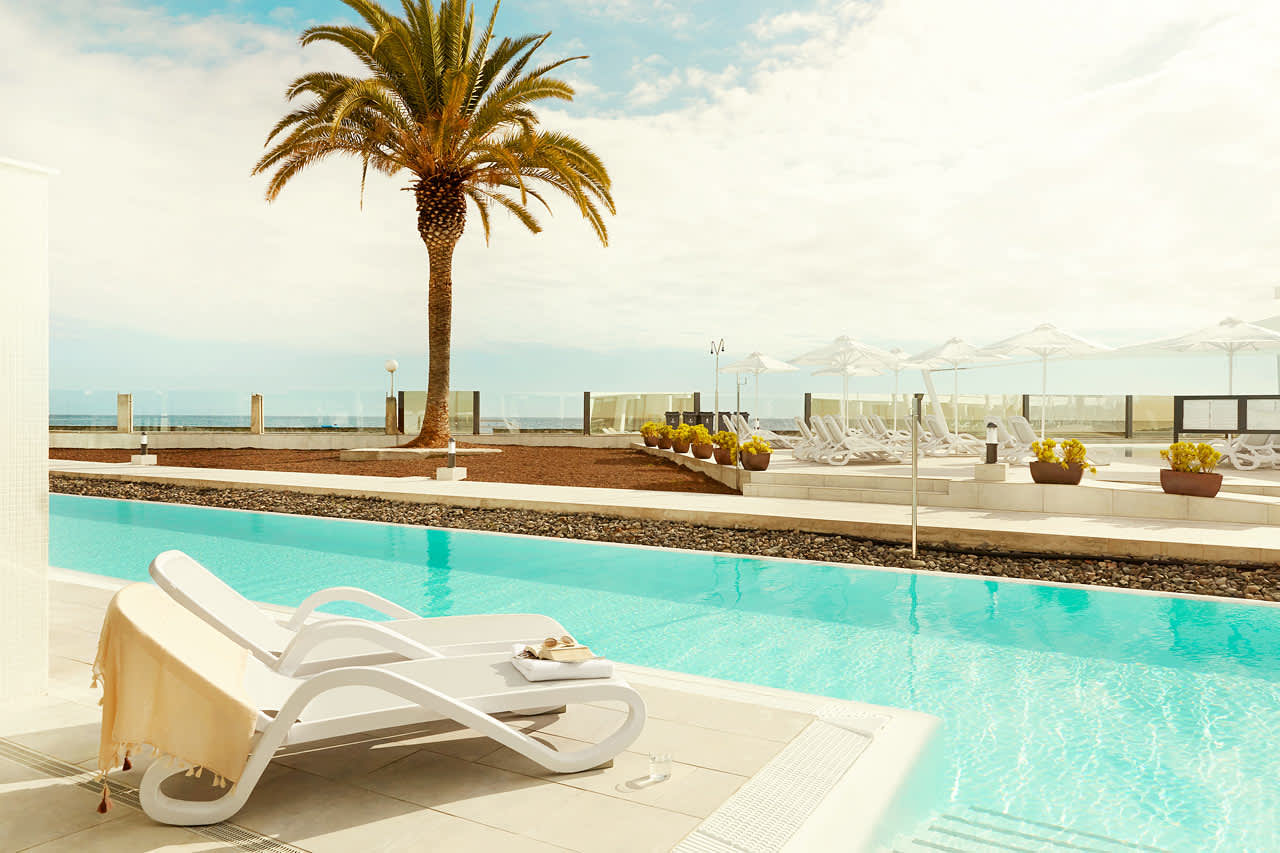 3-roms Club Pool Suite med terrasse og utgang til delt, privat basseng