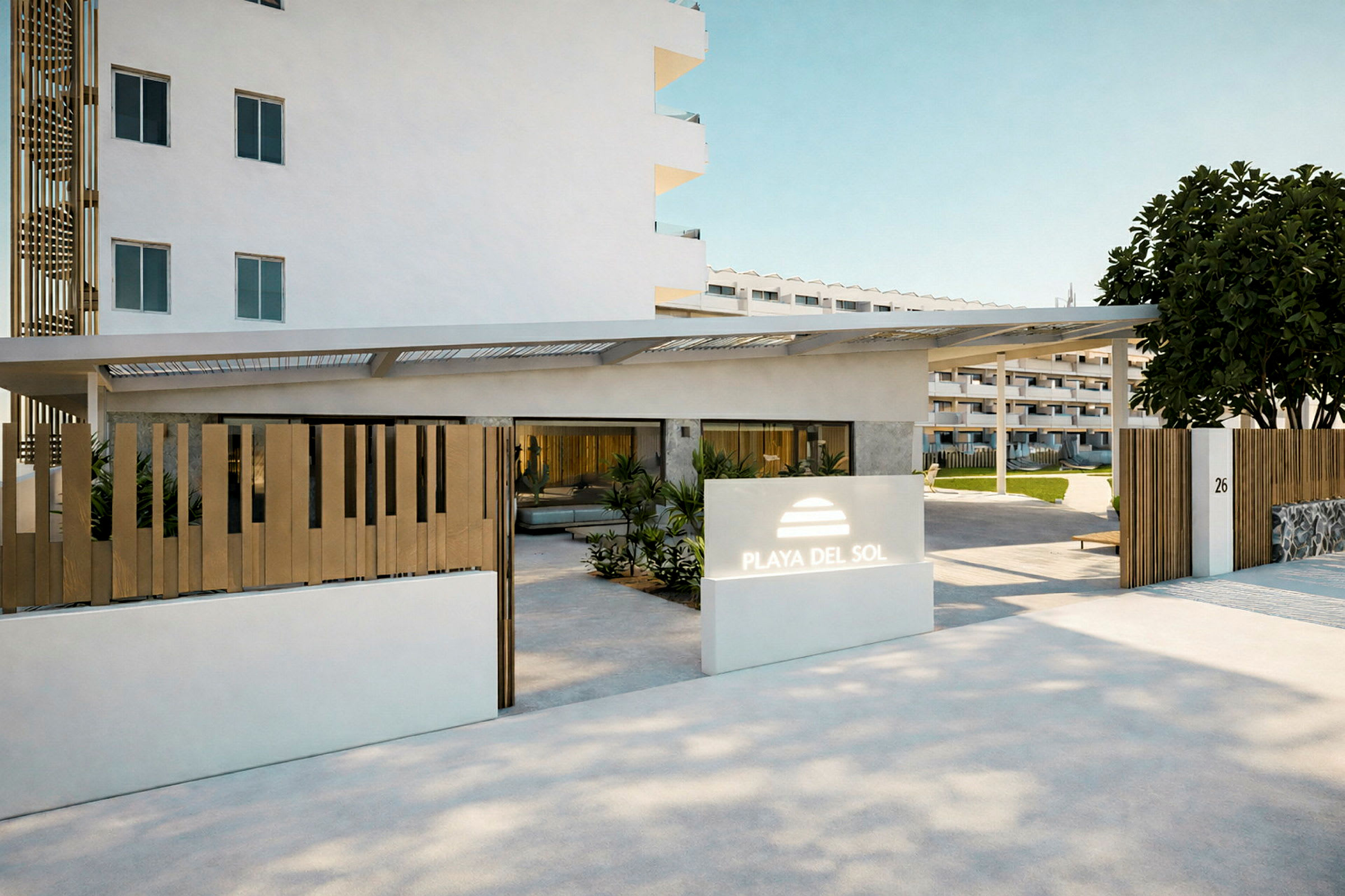 Inngang til hotellområdet med navnet Playa del Sol, inkludert moderne arkitektur og planter rundt bygningene. (AI-generert tekst)