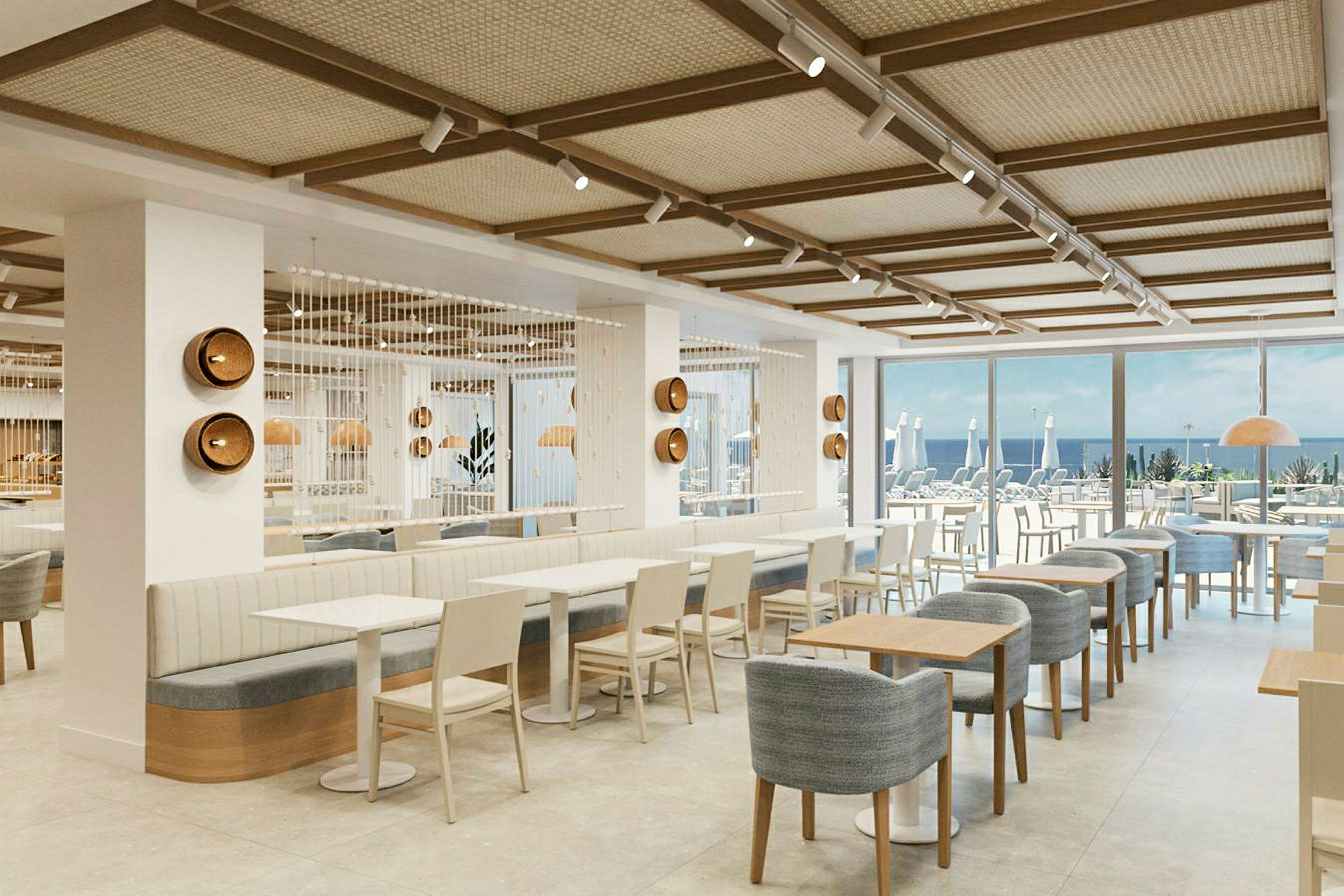 Interiør av en moderne restaurant med sitteplasser og utsikt mot sjøen. (AI-generert tekst)