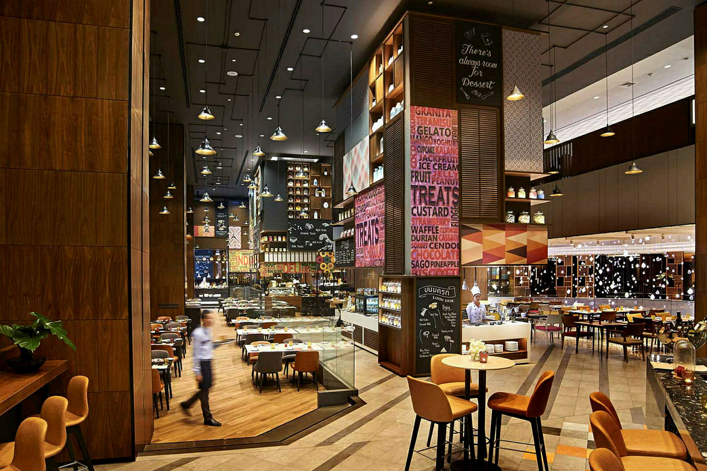 Bilde av en moderne restaurantinteriør med forskjellige sitteplasser, dekorasjoner og belysningsdetaljer. (AI-generert tekst)